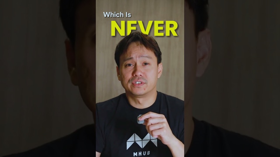 A presenter in a black MHub t-shirt talking to camera, with the on-screen caption "Which is never".